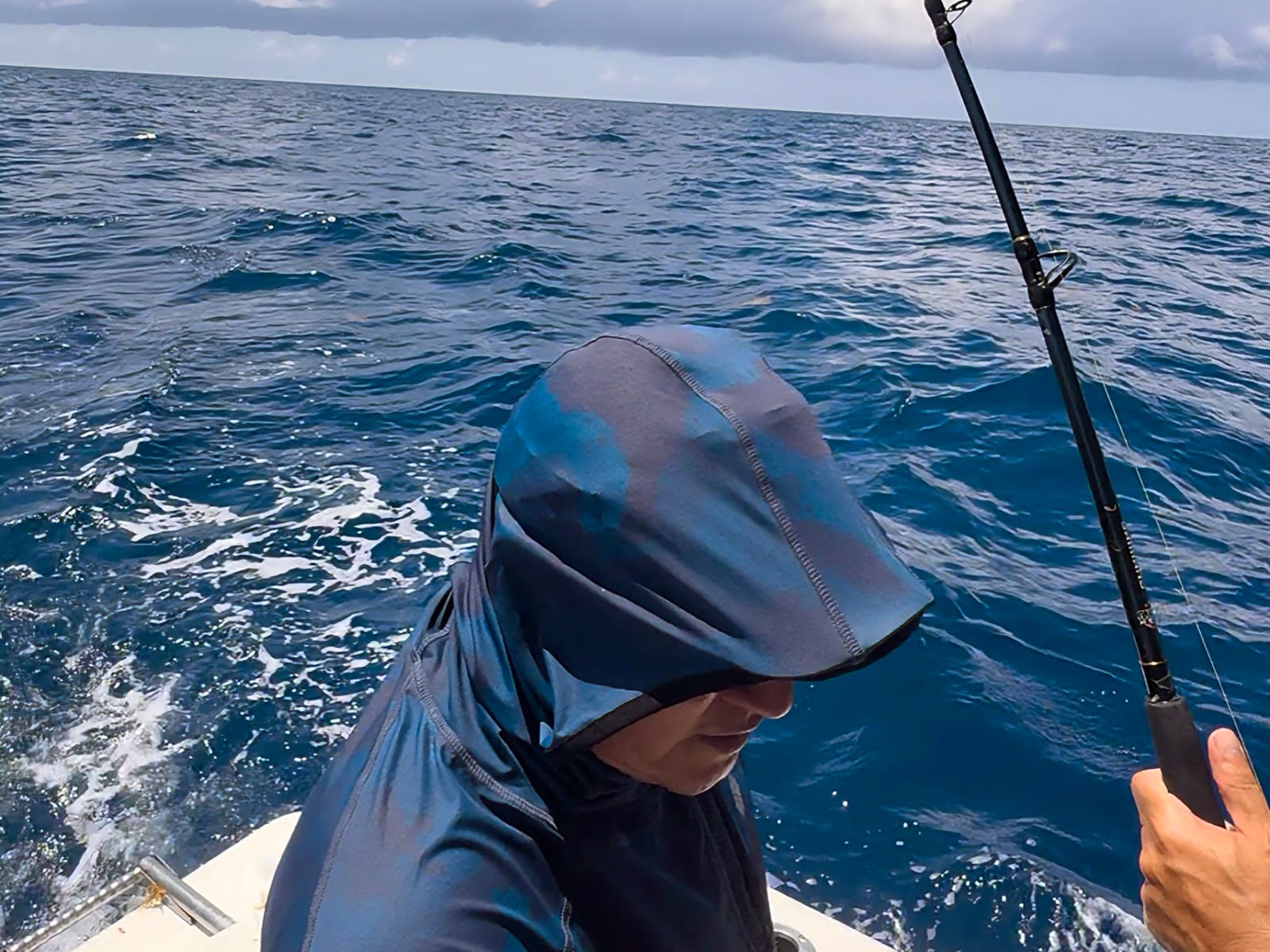 Trolling in the open sea: lines in the water while the boat keeps moving